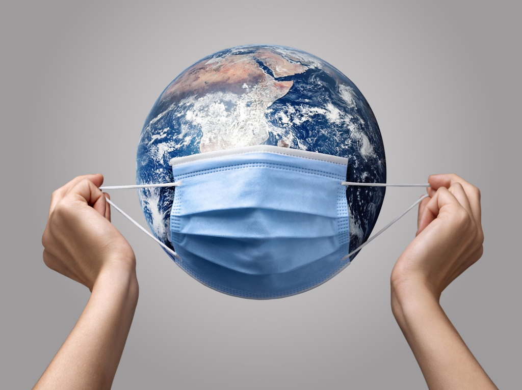 person-putting-medical-mask-earth
